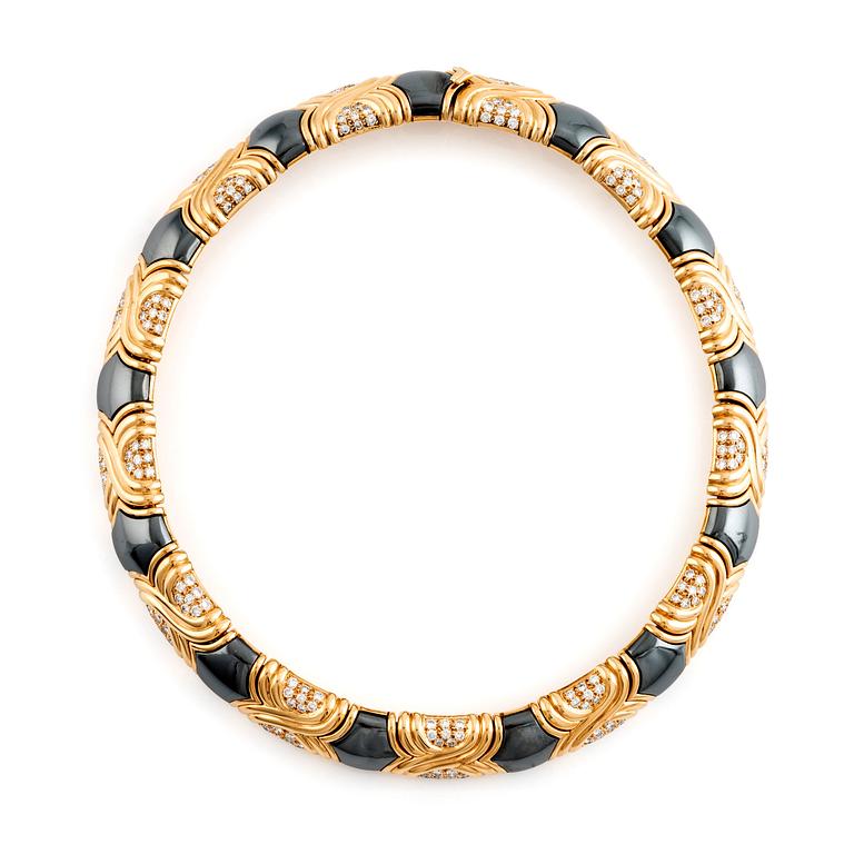A Bulgari 18K gold and hematite necklace set with round brilliant-cut diamonds.
