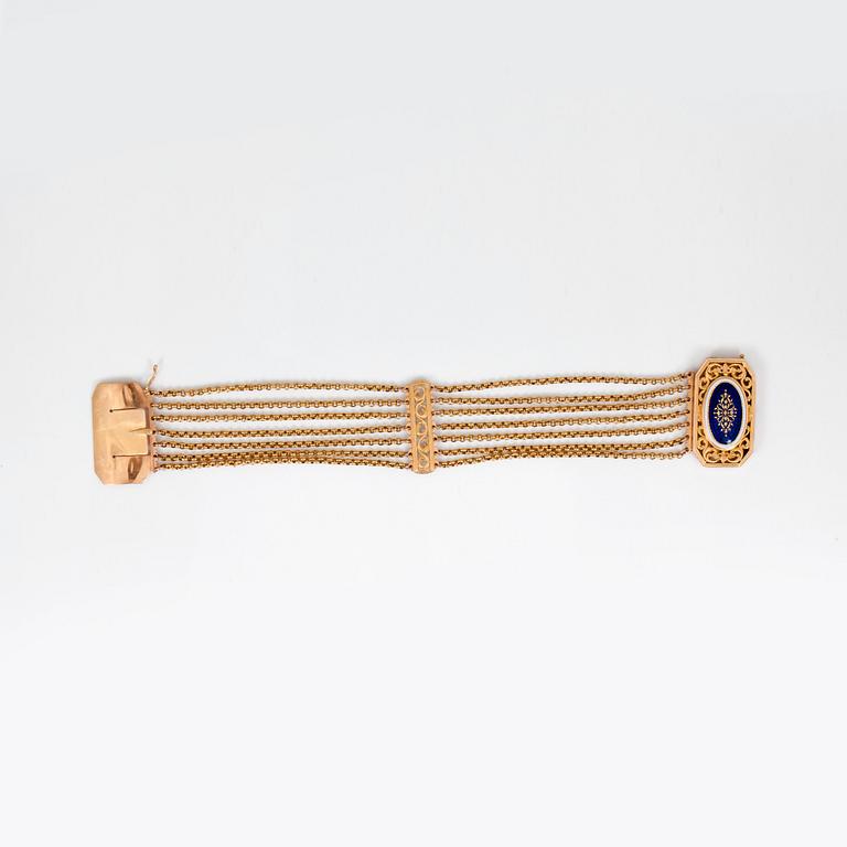ARMBAND med blå och vit emalj. Tillverkat i Stockholm år 1796.