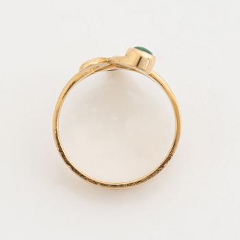 18K gold brilliant cut diamond and  cabochon cut emerald ring.