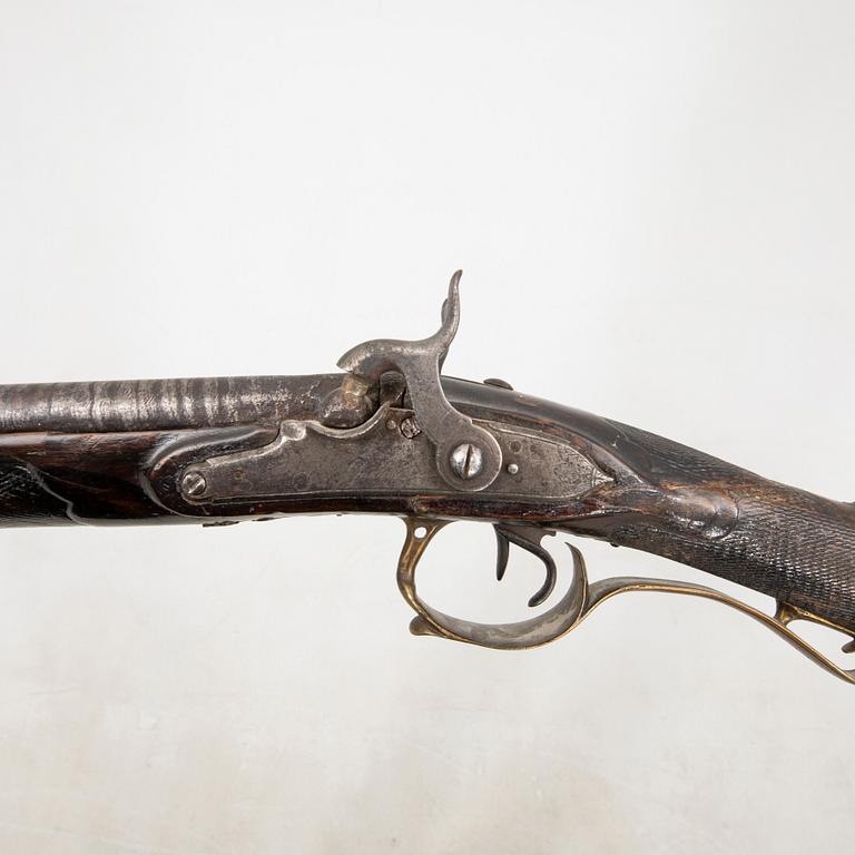 A double barreled percussion gun, 19th century.