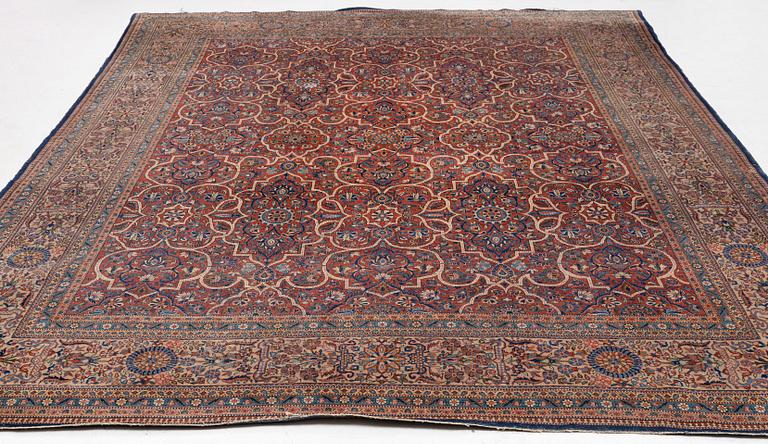 An oriental carpet, c. 425 x 305 cm.