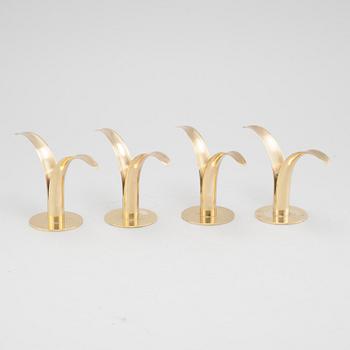 Four brass candle sticks "Liljan" by Ivar Ålenius-Björk for Ystad metall, second half of the 20th century.