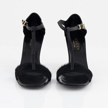Gucci, a pair of black leather and pony hair shoes, Italian size 36.