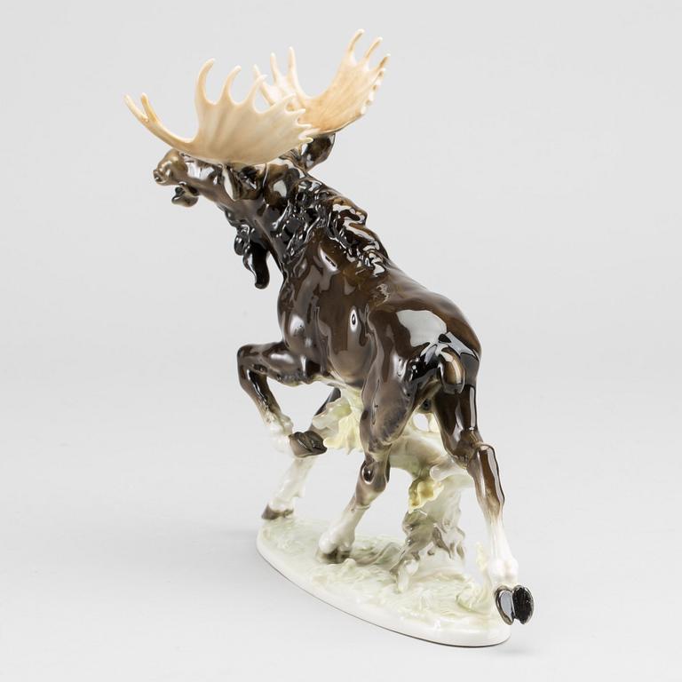 A PORCELAIN FIGURINE BY KARL TUTTER FOR HUTSCHENREUTER.