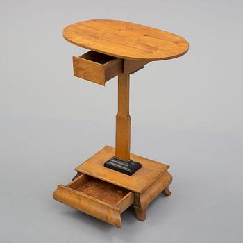 A 19th century sewing table.