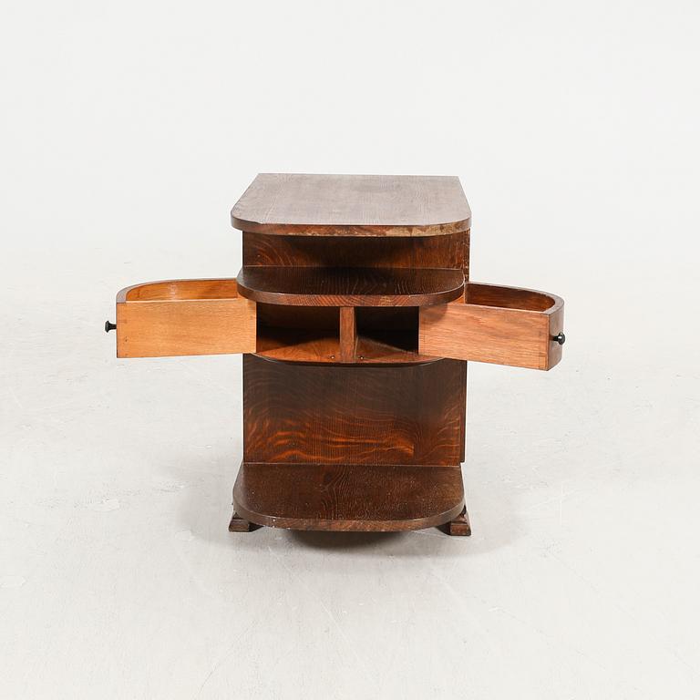 An Art Deco oak side table first half of the 20th century.