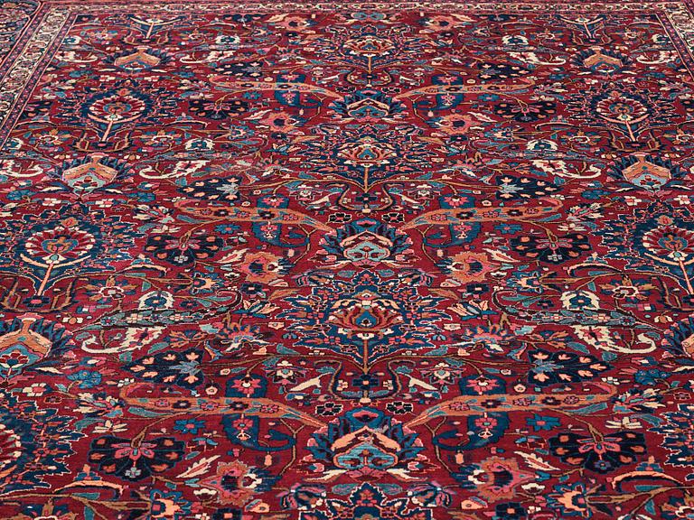 A CARPET, a semi-antique Mashad, ca 400-404 x 314 cm.