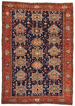 313. A CARPET, a semi-antique Heriz, 335,5-337,5 x 237-240 cm.