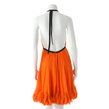 DOLCE & GABBANA, an orange silk cocktail dress.