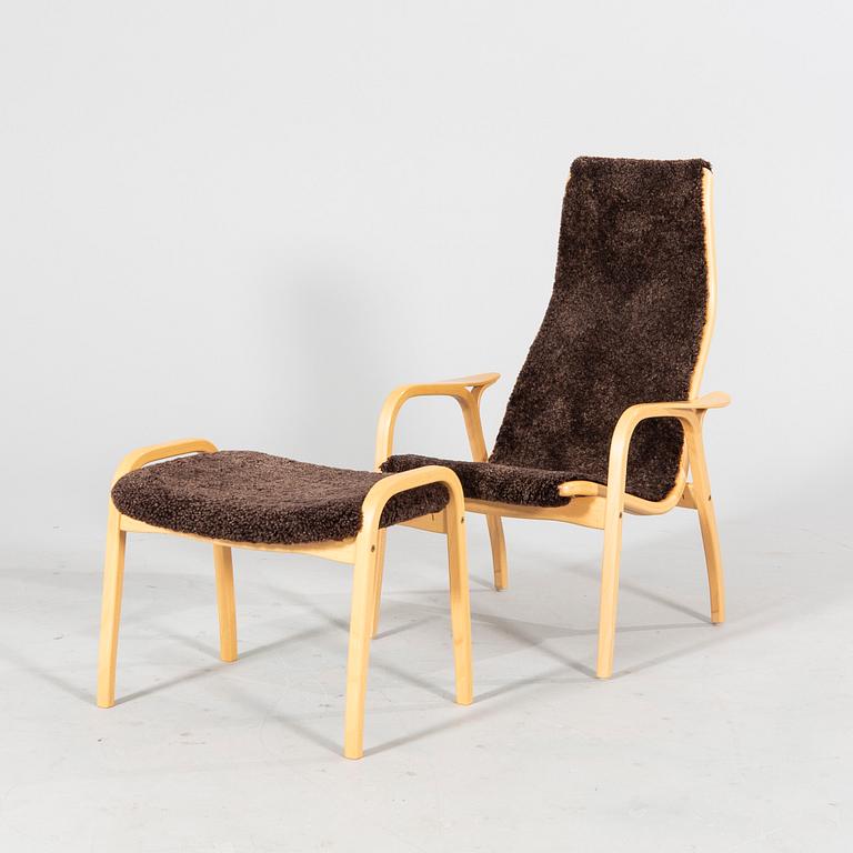 A 'Lamino' lounge chair, foot stool and side table by Yngve Ekström for Swedese.