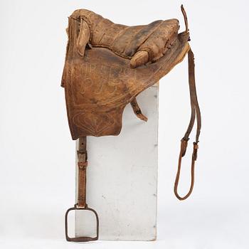A leather saddle of Caucasian type, dated 1821.