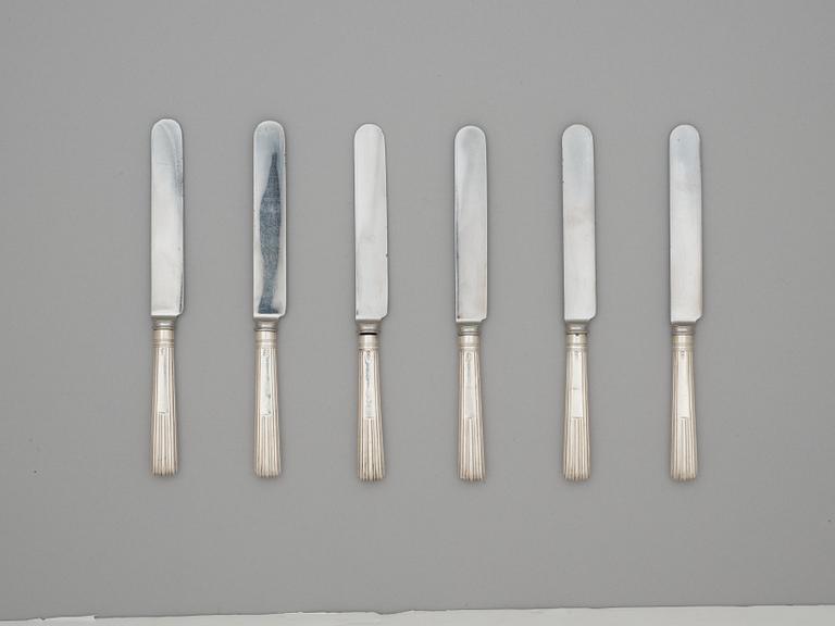 A 19th century silver set of 6+6 dessert forks, five marked Dublin 1849 and knifes, marks of Moses Brent, London 1814.