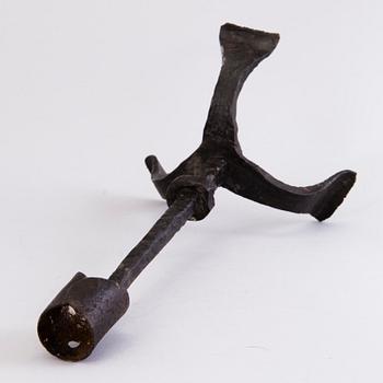 A CANDLESTICK, iron, 18th century or older.