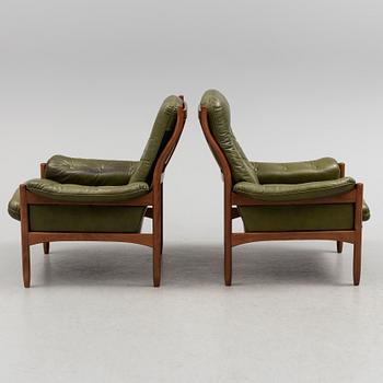 A pair of stained beech and leather easy chairs from Göte Möbler, Nässjö, second half of the 20th century.