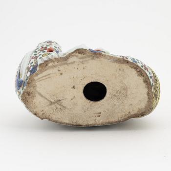 A porcelain 'Budai' figure, China, 20th Century.