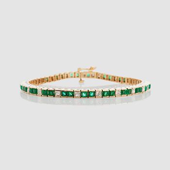 1320. A step-cut emerald and princess-cut diamond bracelet.