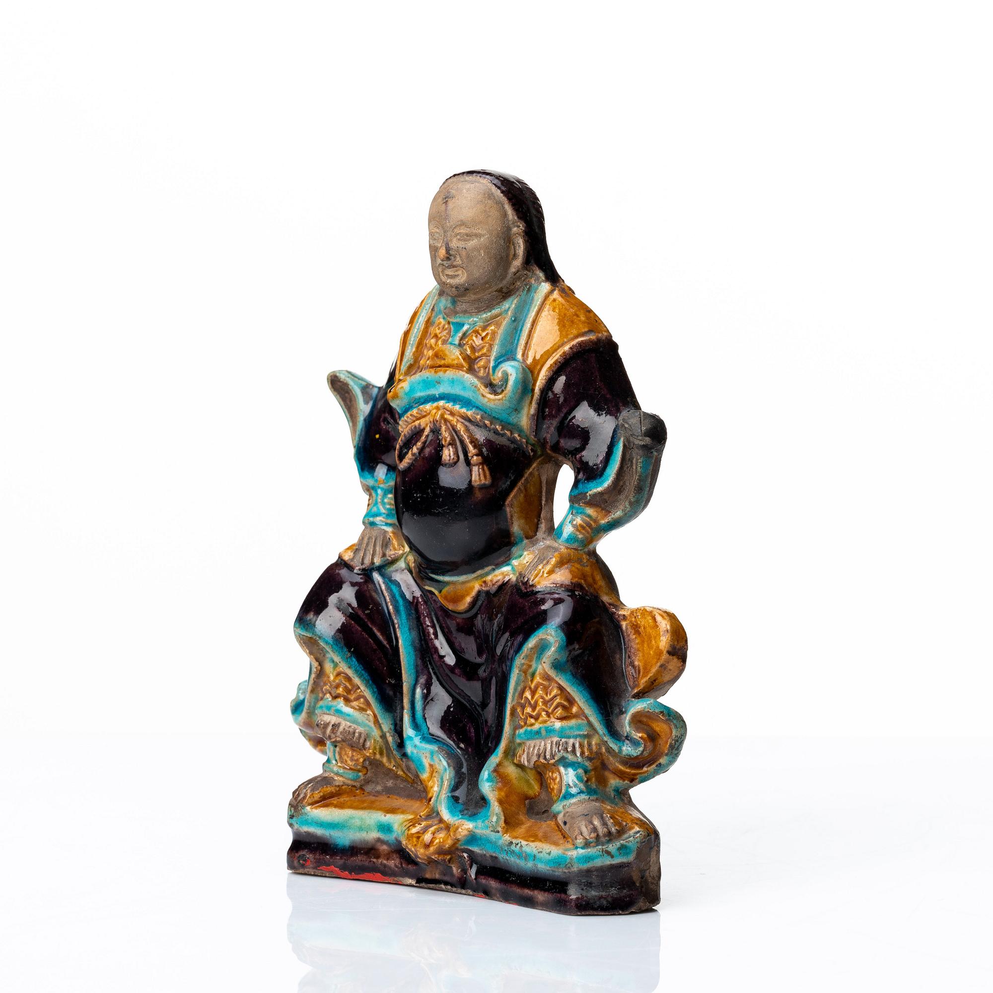 A pottery figure of a the warrior god Guandi, Ming dynasty (1368-1644).