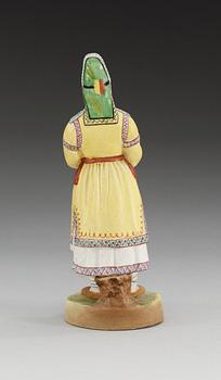 A unmarked Russian bisquit figure depicting a Mordvinian woman, ca 1900.