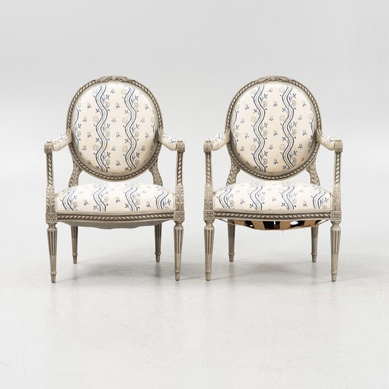 A pair of Gustavian style armchairs, 20th century.