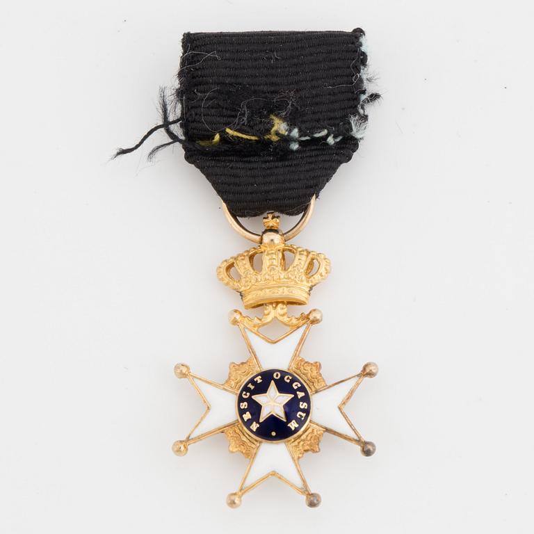 A gilded metal Miniature of the The Royal Swedish Order of the Polar Star with black ribbon.