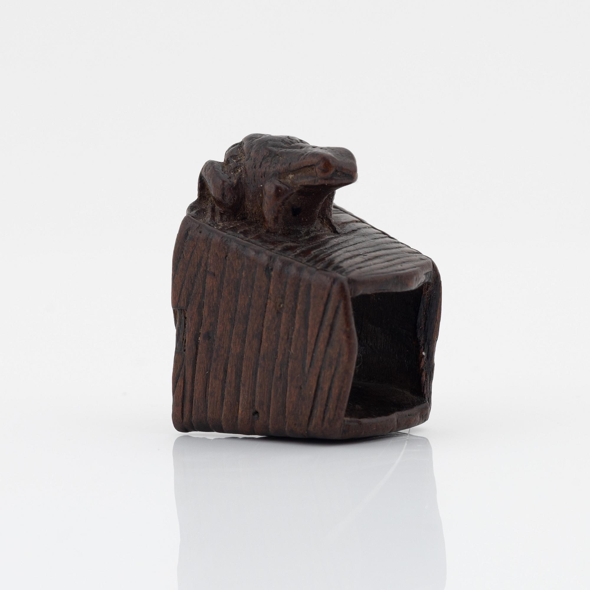 A Japanese wood netsuke of a frog, Masanao Yamada,
Edo period (1615-1868), 19th century.
