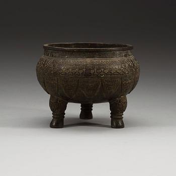 A bronze tripod censer, presumably Ming dynasty.