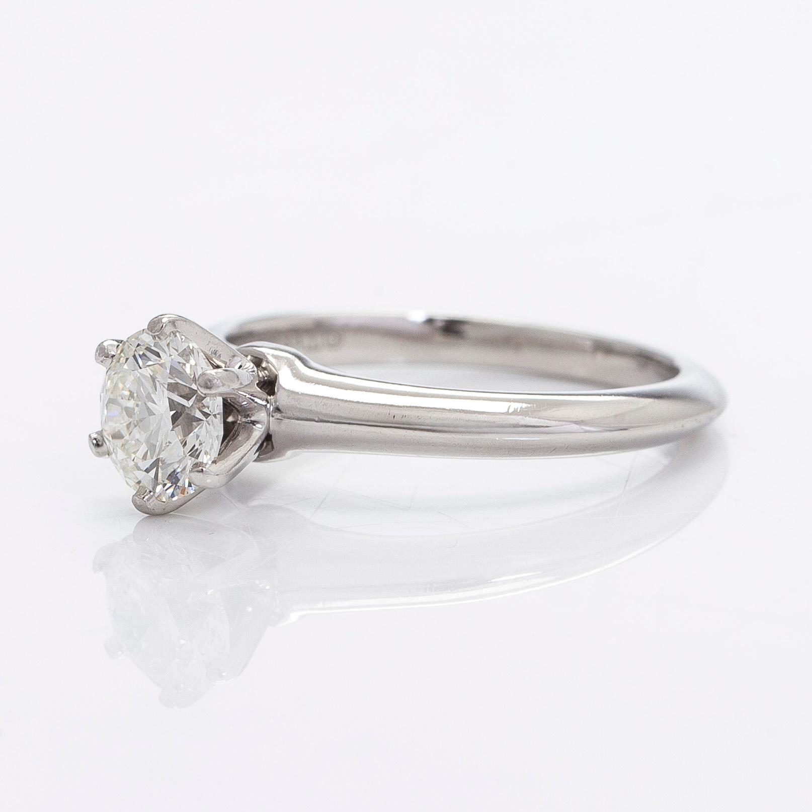 Tiffany & Co, a platinu solitaire ring with a brilliant-cut diamond.