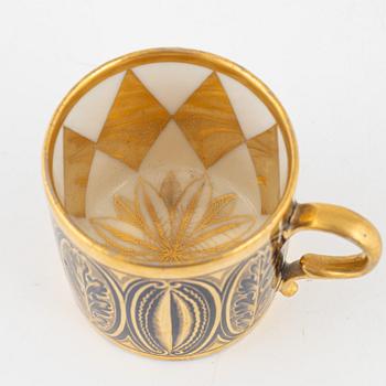 A porcelain cup and saucer, France, 19th century.