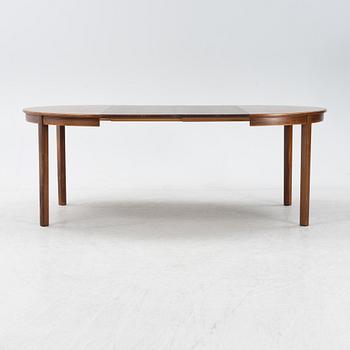 A 1960's/70's rosewood veneered dining group.