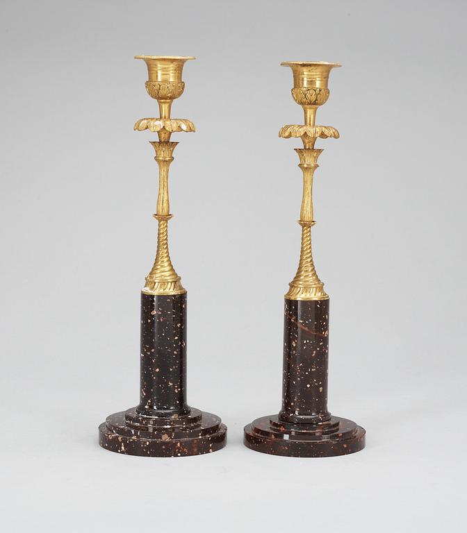 Two matched late Gustavian circa 1800 porphyry and bronze candlesticks.