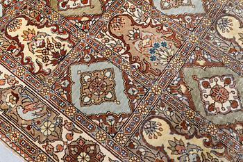 A semi-antique figural Kaysari silk carpet, approx. 100 x 70 cm.