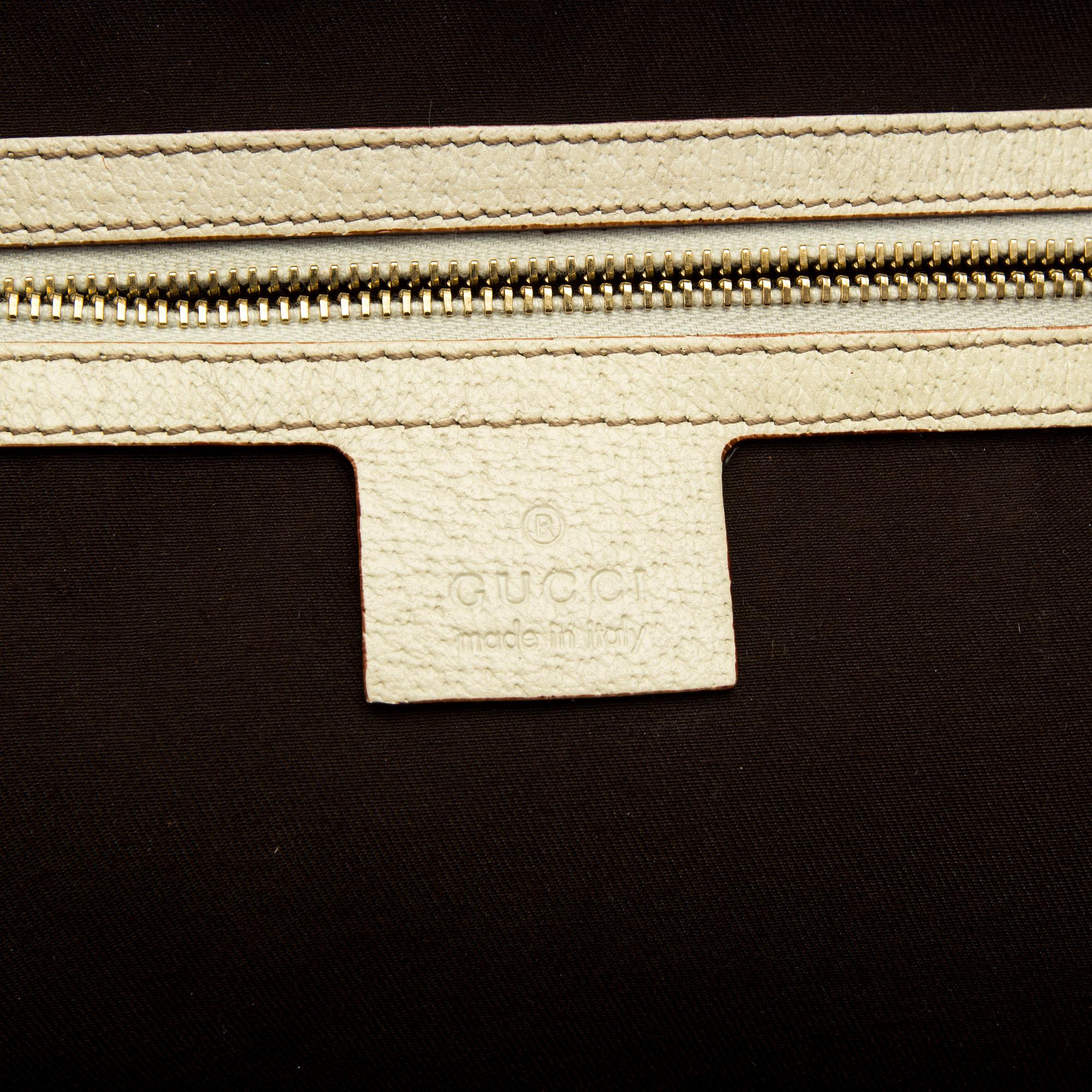 A Gucci canvas and leather hand bag.