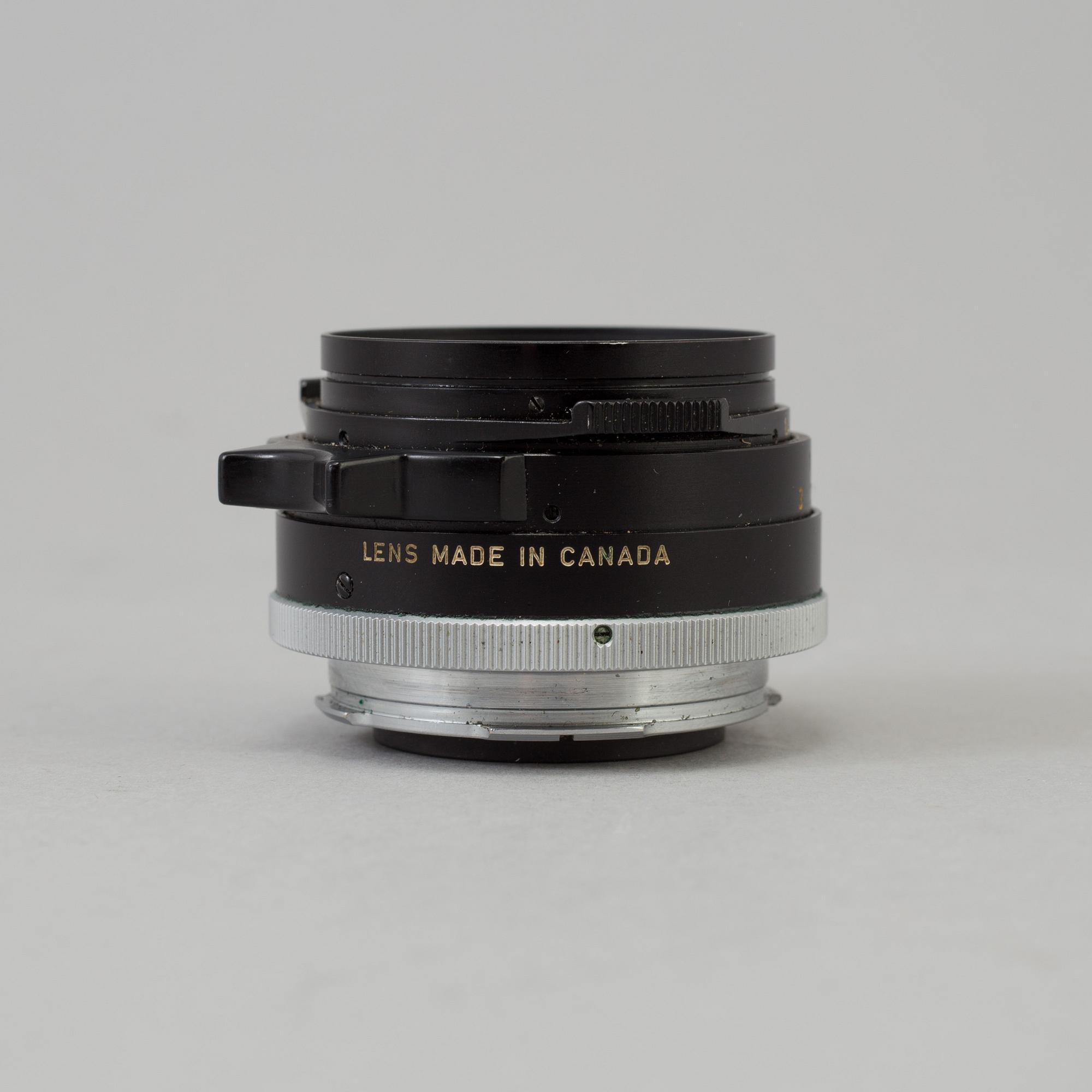 A black Leica Summilux 1:1.4 /35 Leitz  Lens no 2391303, Canada.