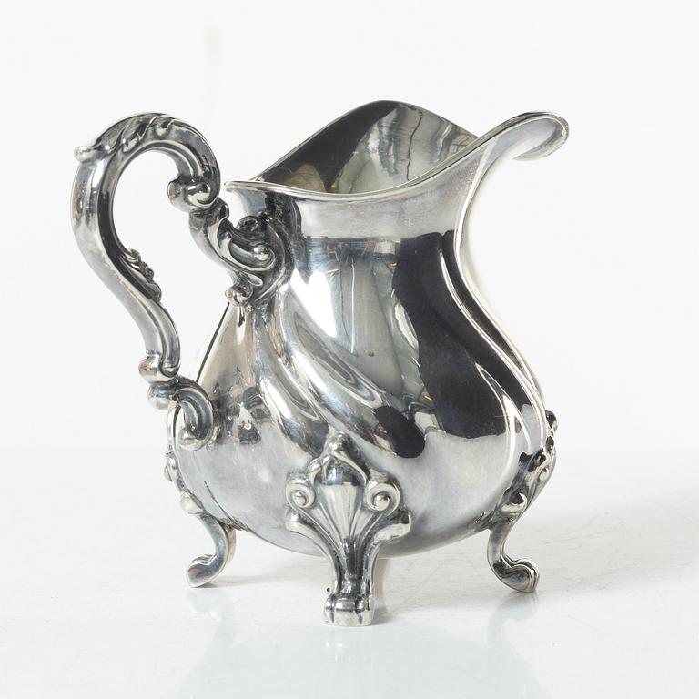 A Norwegian silver Rococo style coffee pot, cream jug, and sugar bowl, Norsk Filigransfabrikk, Oslo circa 1920.