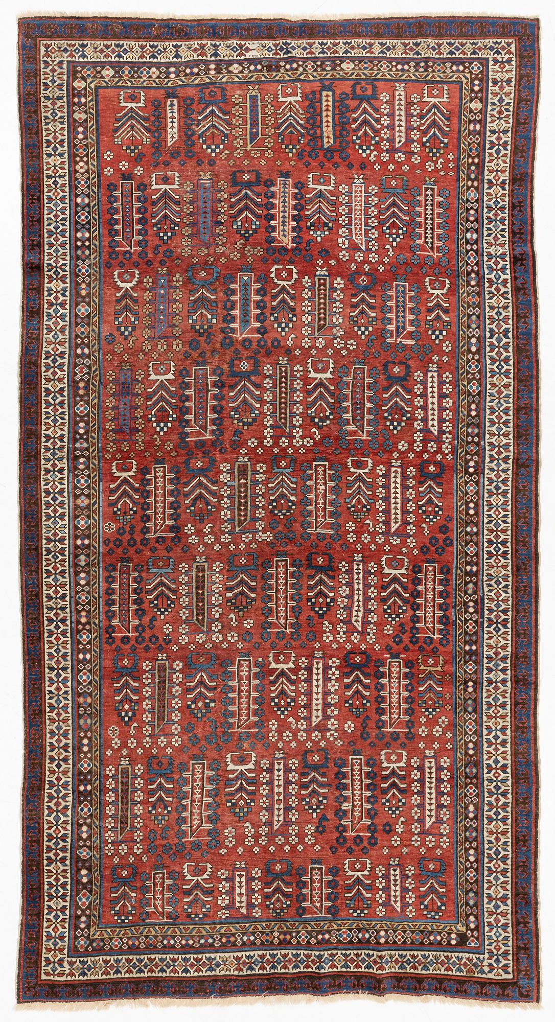 An antique carpet, probably Shirvan, c. 330 x 172 cm.