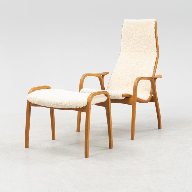 Yngve Ekström, a 'Lamino' armchair and a foot stool, Swedese, 2002.