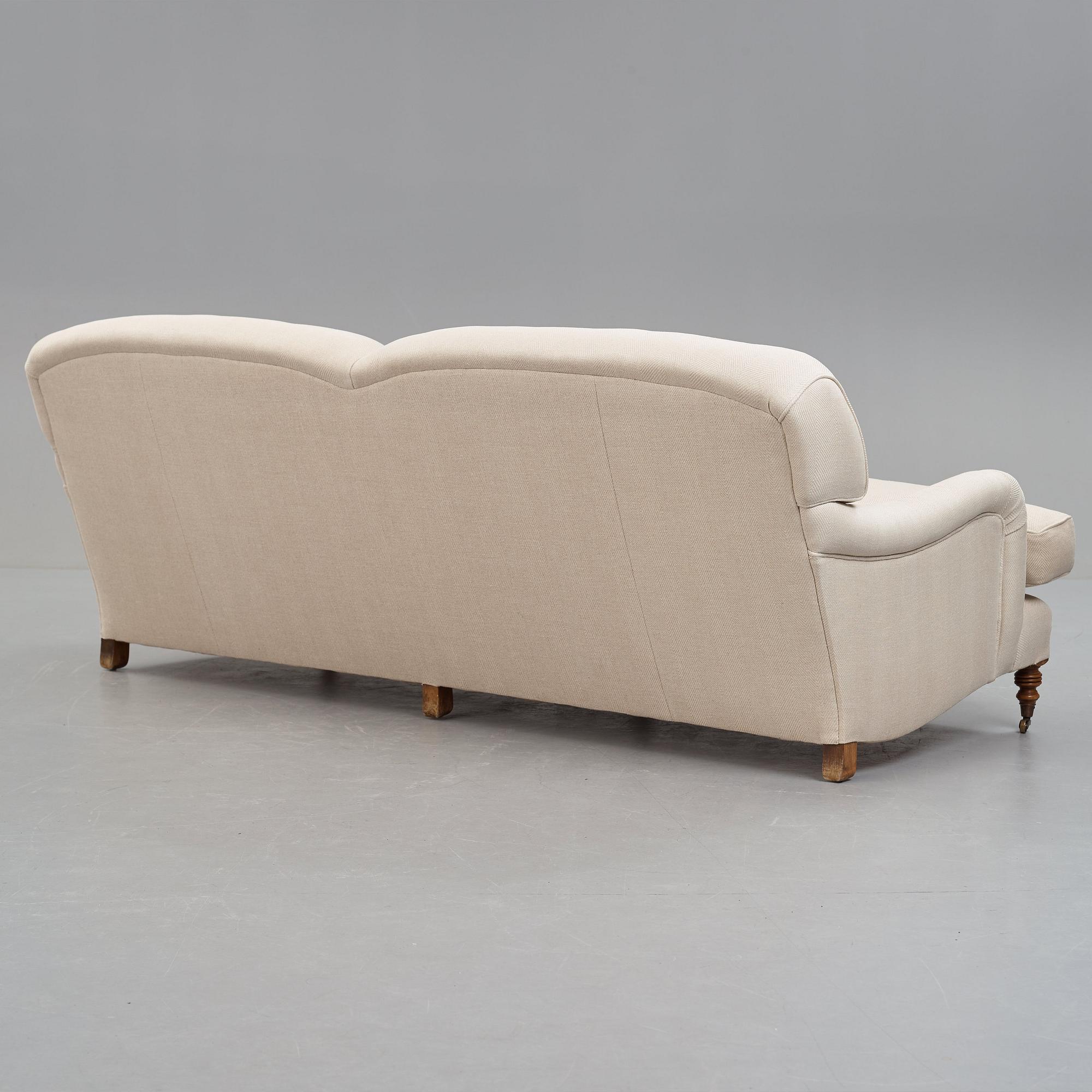SOFA, "Howard", upholstered in an off-white fabric.
