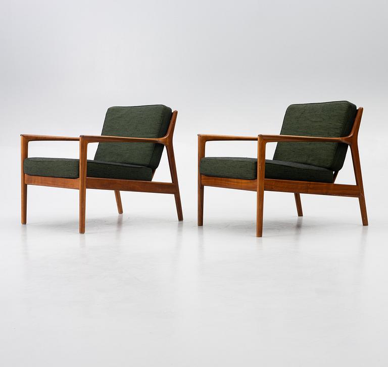 Folke Ohlsson, a pair of 'USA 75' armchairs, Dux, Sweden, 1960's.