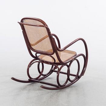 A first half of the 20th century rocking chair.