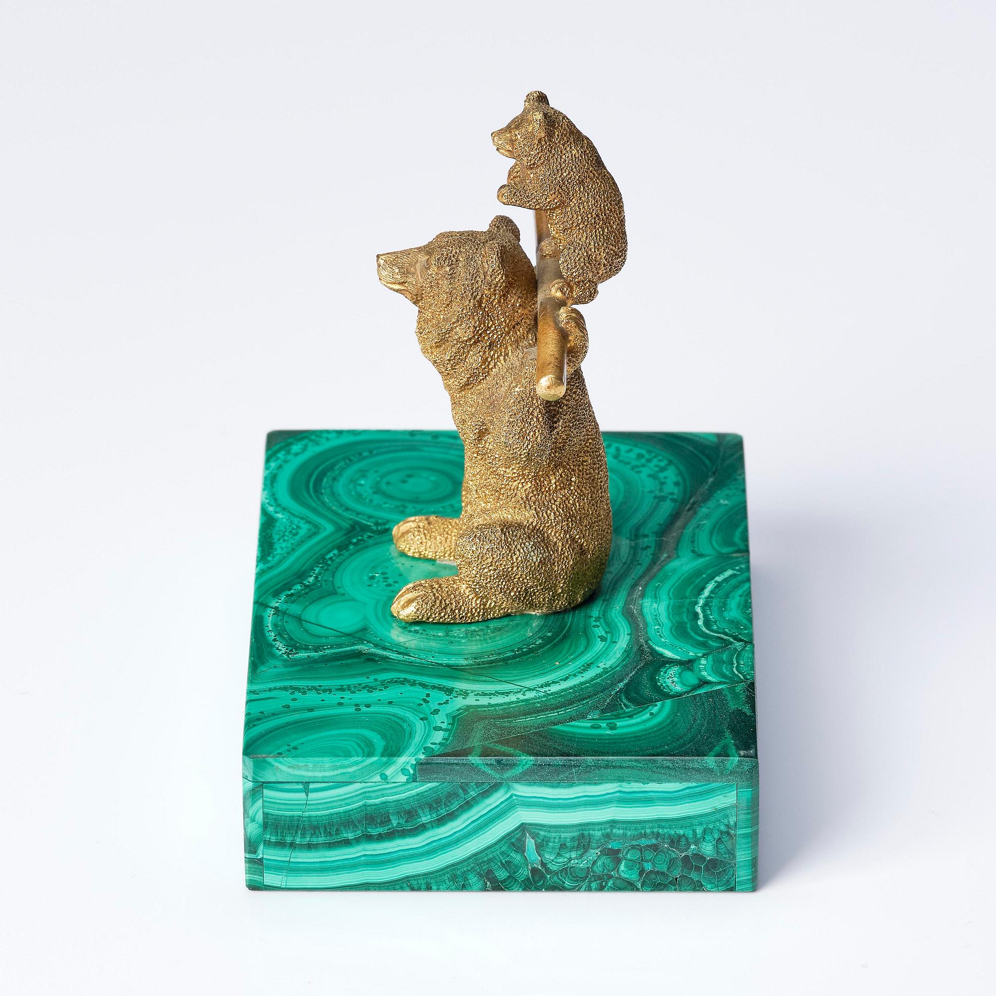 A Russian Nicholas II malachite-veneered and gilt-bronze paperweight, late 19th century.
