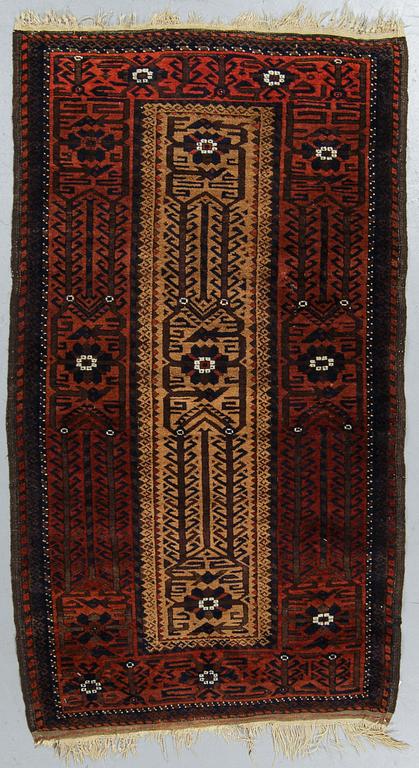 A rug, a semi-antique Baluch, ca 166 x 92 cm.