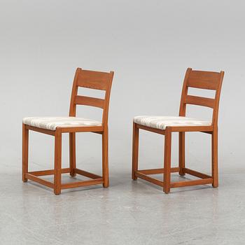 Six chairs by Carl Malmsten and a table by an unknown maker.