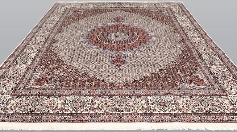 A part silk Moud carpet, approximately 350 x 252 cm.