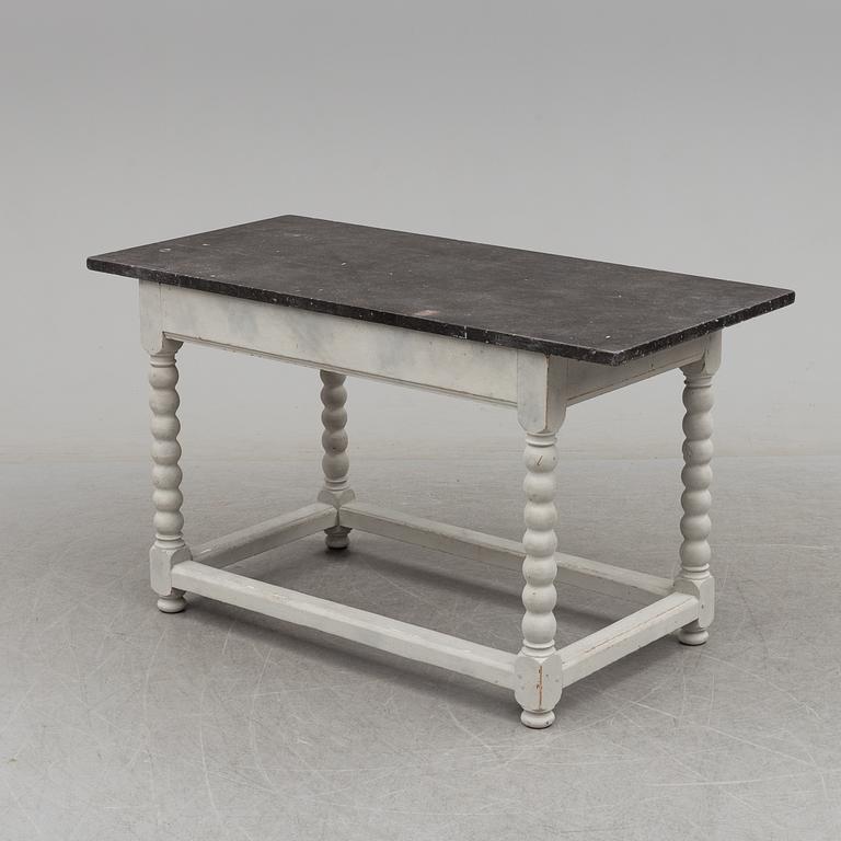 A 19/20th century stone top baroquestyle table.