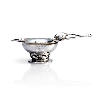 440. Georg Jensen, a "Blossom" sterling silver tea-strainer with stand, sterling silver, Copenhagen 1933-44.