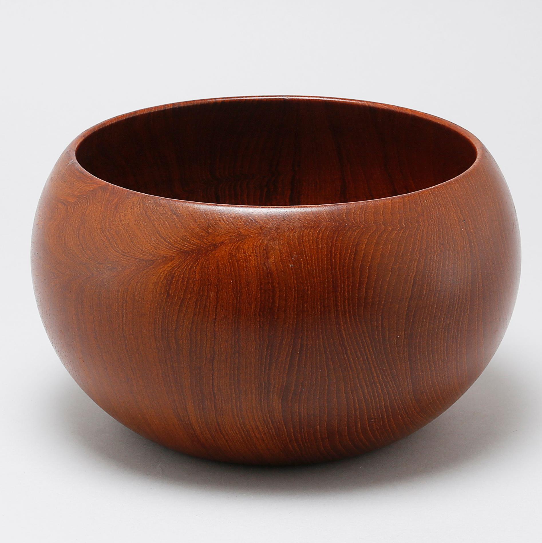 A wooden bowl, designed by Kay Bojesen.