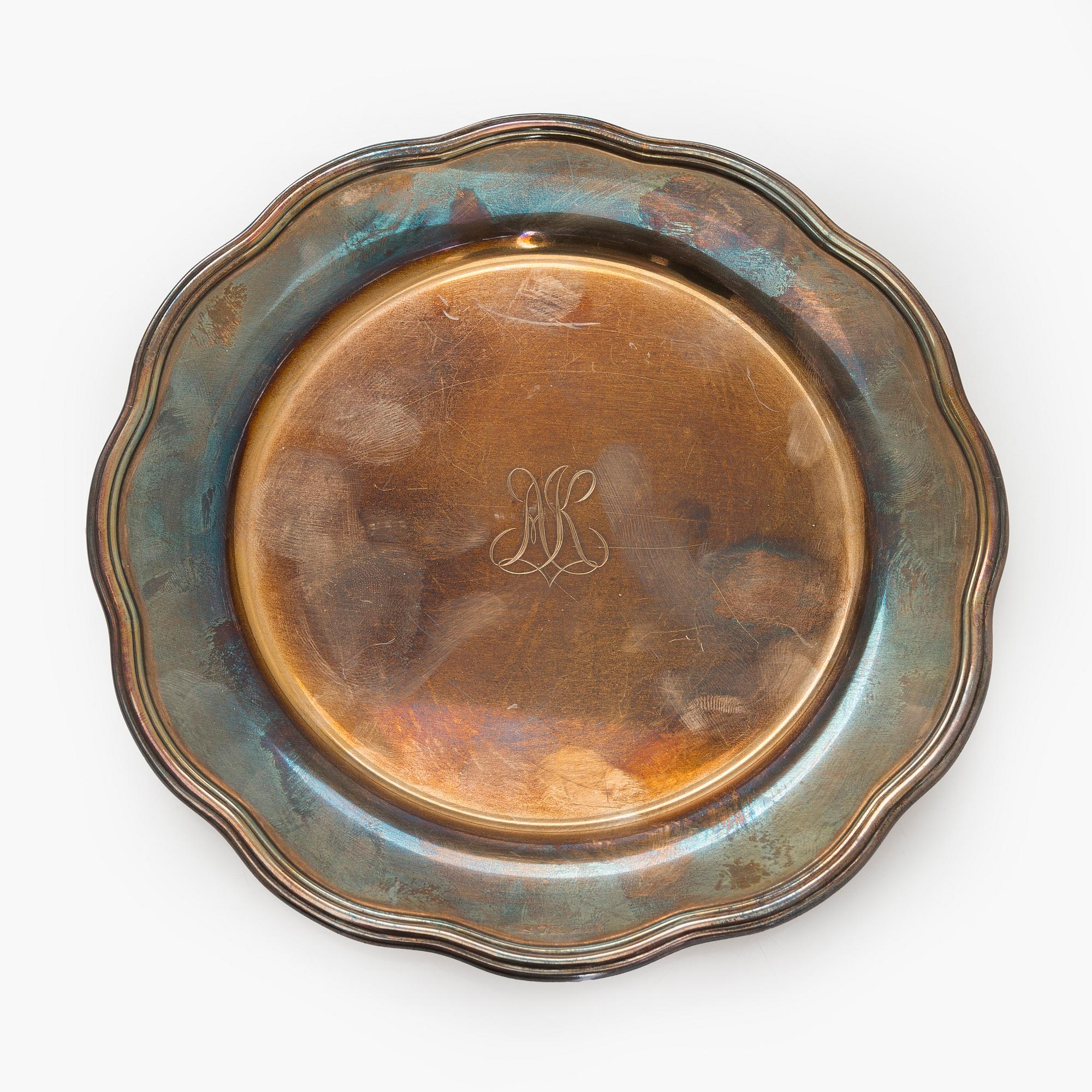 A 10-piece set of silver chargers, Kultateollisuus, Turku 1938 and 1980.