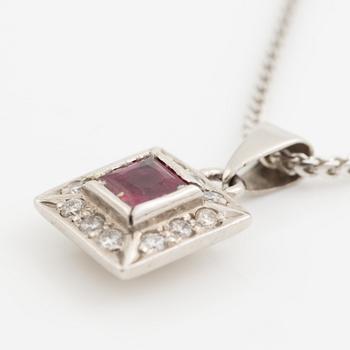 Pendant with chain in 18K white gold featuring a red stone, likely a ruby, and diamonds.