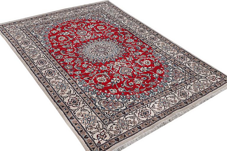 A Nain carpet, part silk, 9 laa, c. 303 x 198 cm.