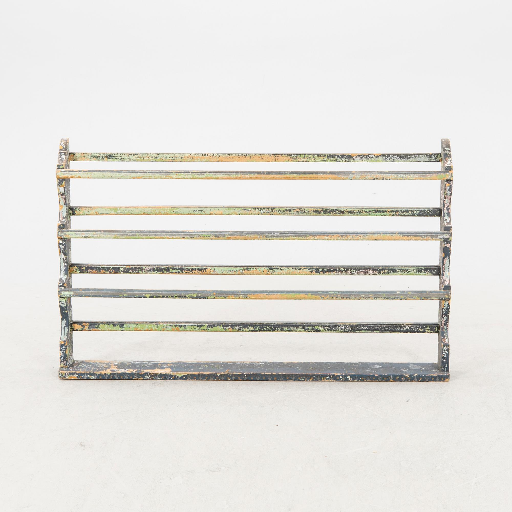 A painted early 1900s shelf.